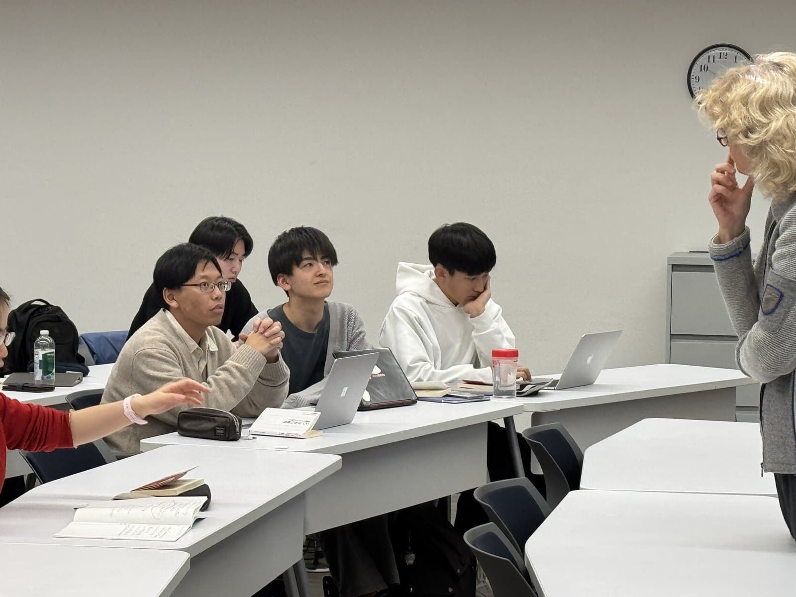Participants in a small-group seminar, seated close to the instructor